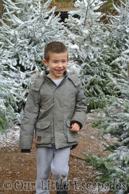 ethan running through snow santas woodland workshop center parcs elveden forest