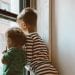 two boys looking outside window 3273852 featured image