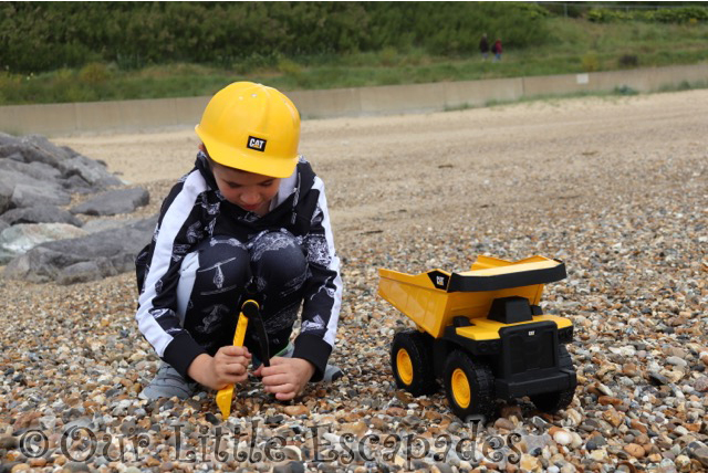 ethan scooping stones cat steel dump truck caterpillar construction toys