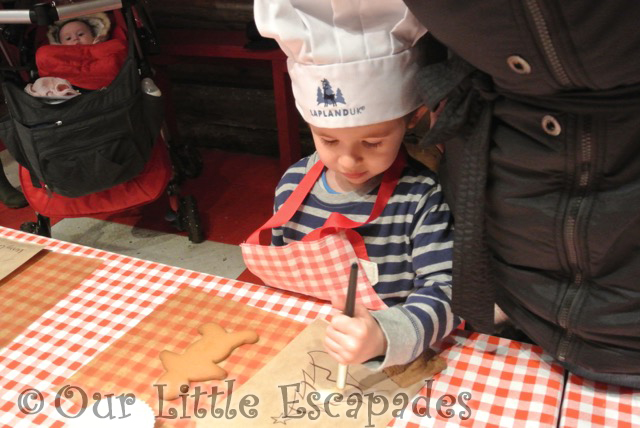 ethan chef hat using icing paintbrush lapland uk superstar day