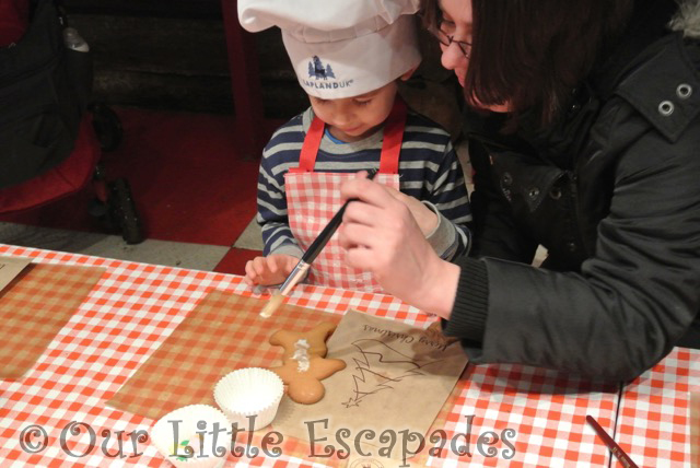 ethan jane helping decorate gingerbread man lapland uk superstar day