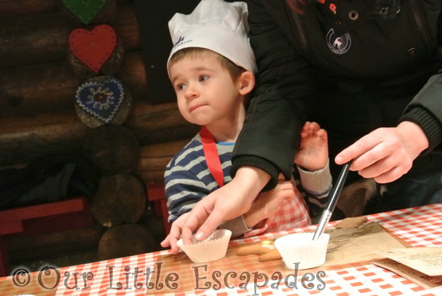 jane helping ethan decorate gingerbread man lapland uk superstar day