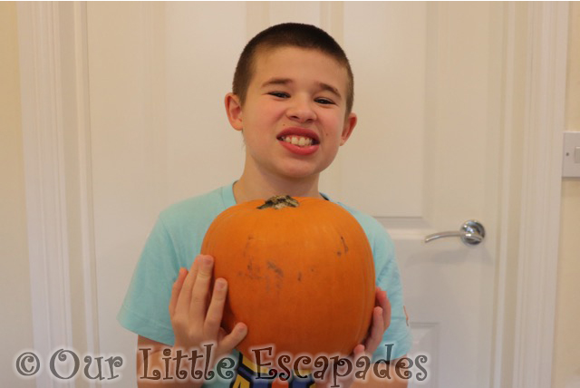 ethan holding pumpkin