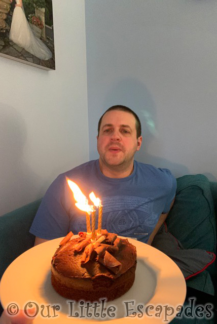 darren blowing out candles birthday cake