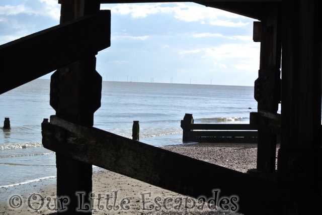 hiding under beach huts frinton-on-sea my sunday photo