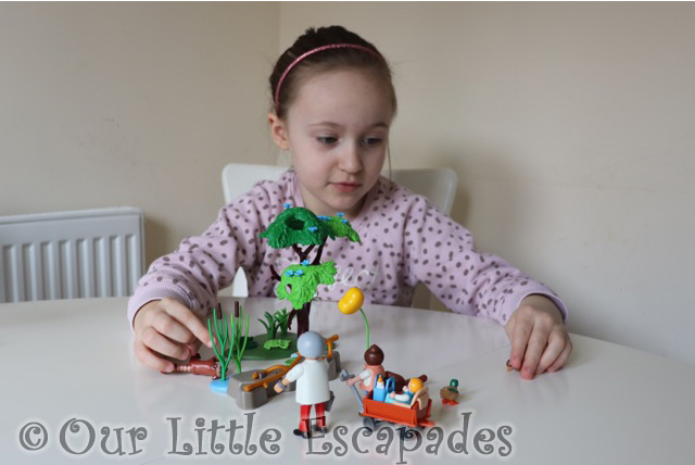 little e playing playmobil red panda habitat