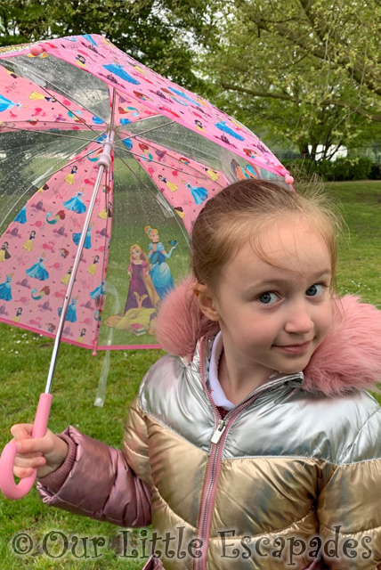 little e holding princess umbrella