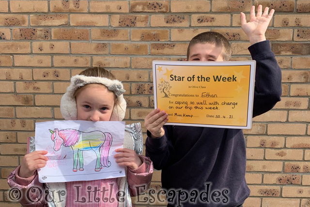 little e holding unicorn drawing ethan holding star of the week