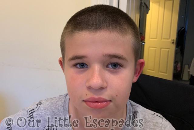 ethan showing off hair cut