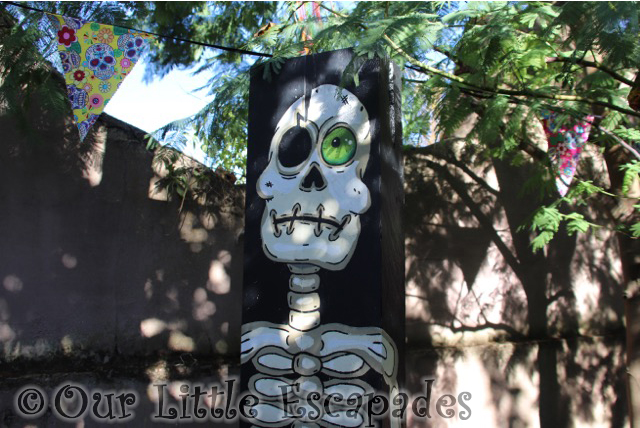 skeleton painted post fiesta footpath