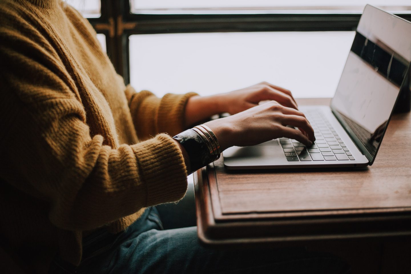 person sitting front laptop