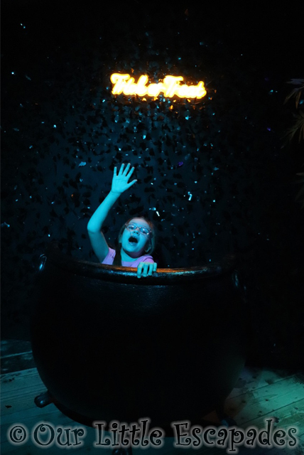 little e inside witches cauldron