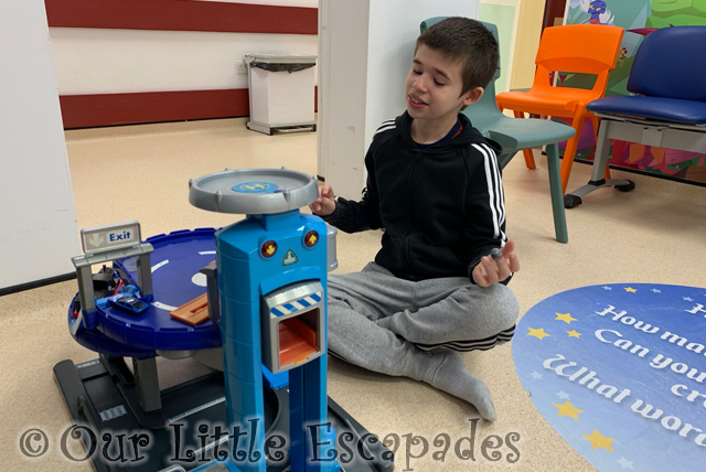 ethan playing toy garage hospital waiting room