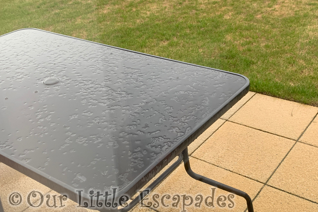 raining wet garden table patio grass