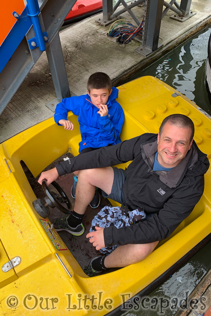 smiling darren ethan driving yellow logoland boat legoland windsor