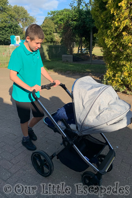 ethan pushing pram