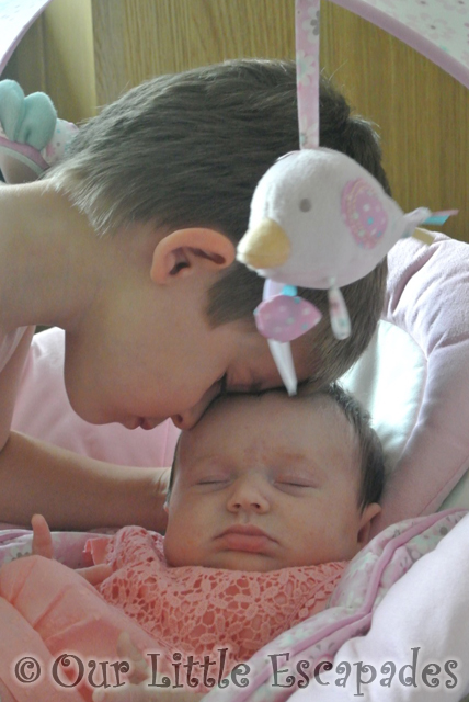 ethans head touching little es head 8 weeks old