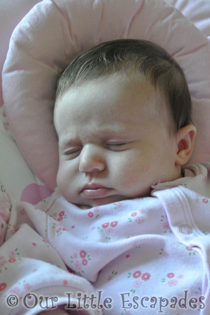 little e asleep frowning face 8 weeks old